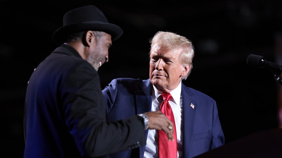 Boxing Hall of Famer Thomas 'Hitman' Hearns joins Trump on stage at Detroit rally: 'This can't be real'