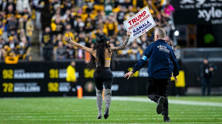 Woman runs onto Steelers' field with pro-Trump sign as former president attends game