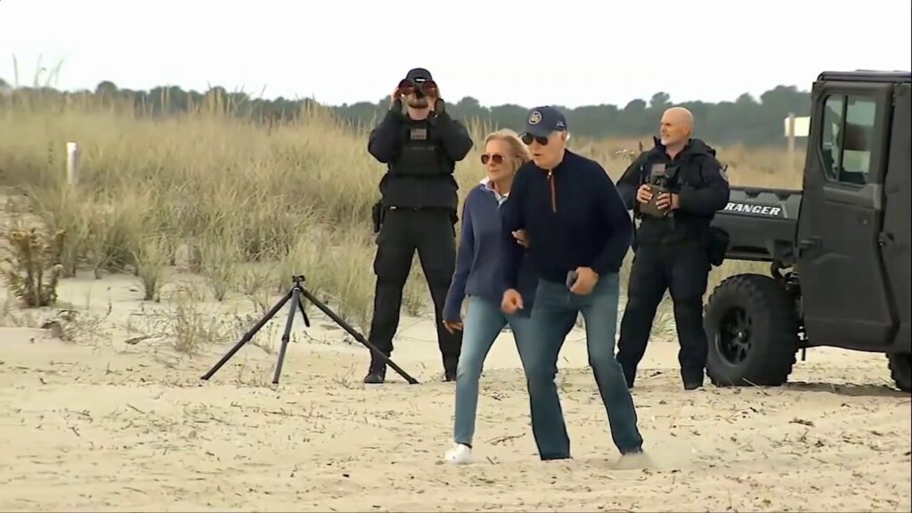 President Biden appears to struggle while walking on beach with first lady