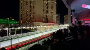 F1 drivers zoom down the straightaway at the Las Vegas Grand Prix