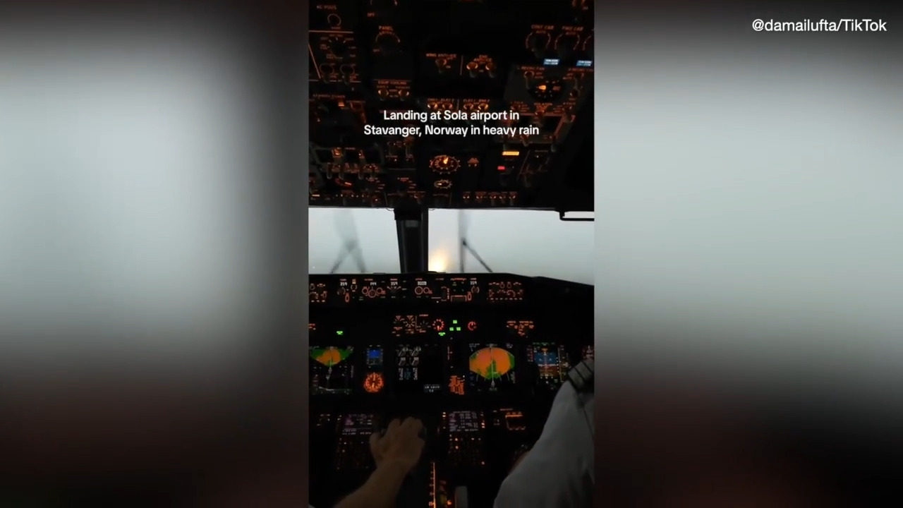 Footage showing pilots landing plane in 'heavy rain' viewed by millions