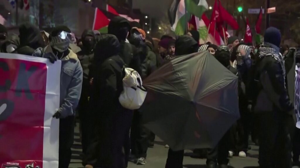 Montreal demonstrators clash with police, set off smoke bombs in destructive protest