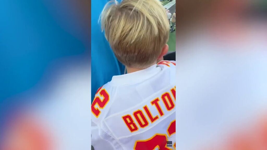 Chiefs lineman catches young fan after falling over barrier at Panthers' stadium