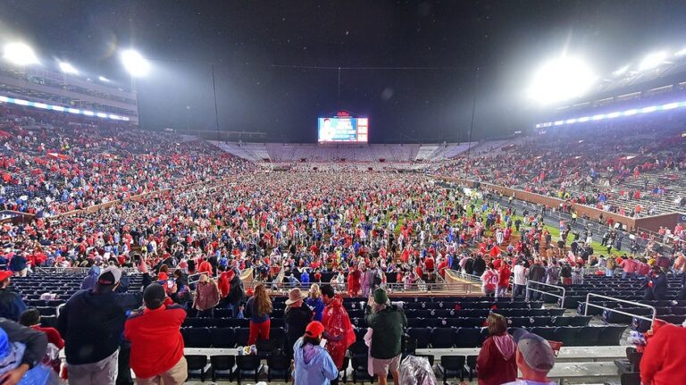 Ole Miss fans storm field with time remaining on clock, prompting delay to game's end