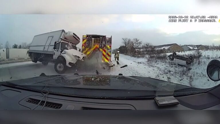 Out-of-control semi-truck jackknifes first responder vehicles on icy highway in Michigan