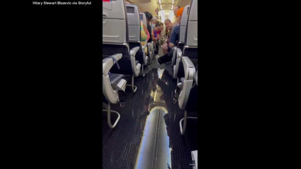 American Airlines passenger films as plane floods from lavatory leak