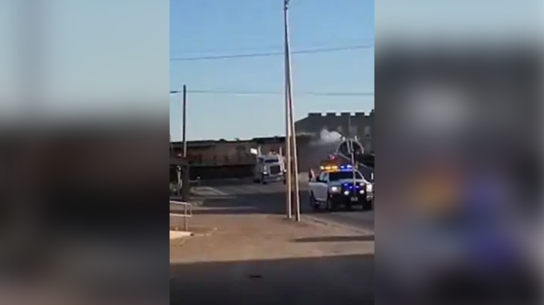 Texas train derails after hitting tractor-trailer, barrels into city building: video