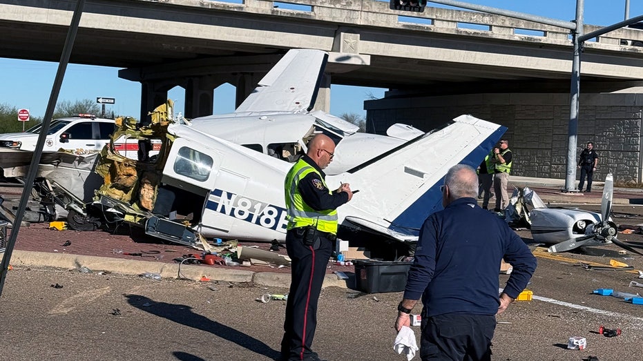 Aftermath of small plane crash onto Texas roadway caught on camera with split fuselage, damaged vehicles