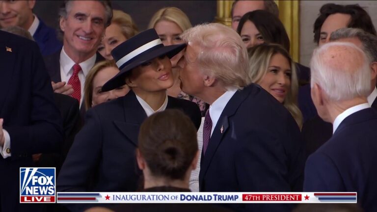 Trump attempts to kiss Melania as he enters the swearing-in ceremony