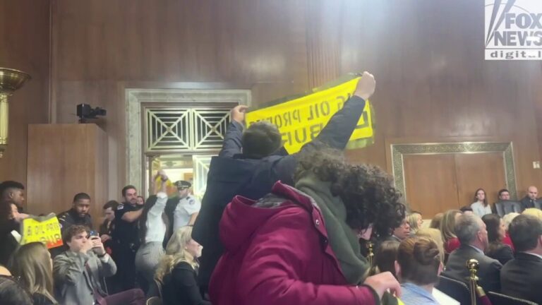 More protestors interrupt and are escorted out of Chris Wright's confirmation hearing