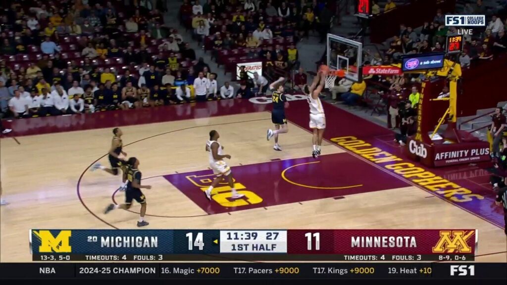 Dawson Garcia throws down a strong dunk, trimming the Michigan lead over Minnesota