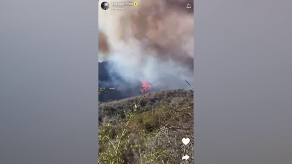 Pacific Palisades Fire engulfs homes on mountain