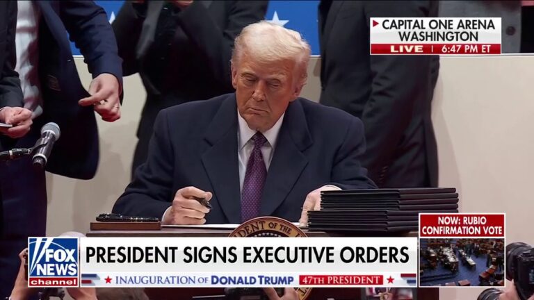 Trump signs executive orders at inauguration day rally