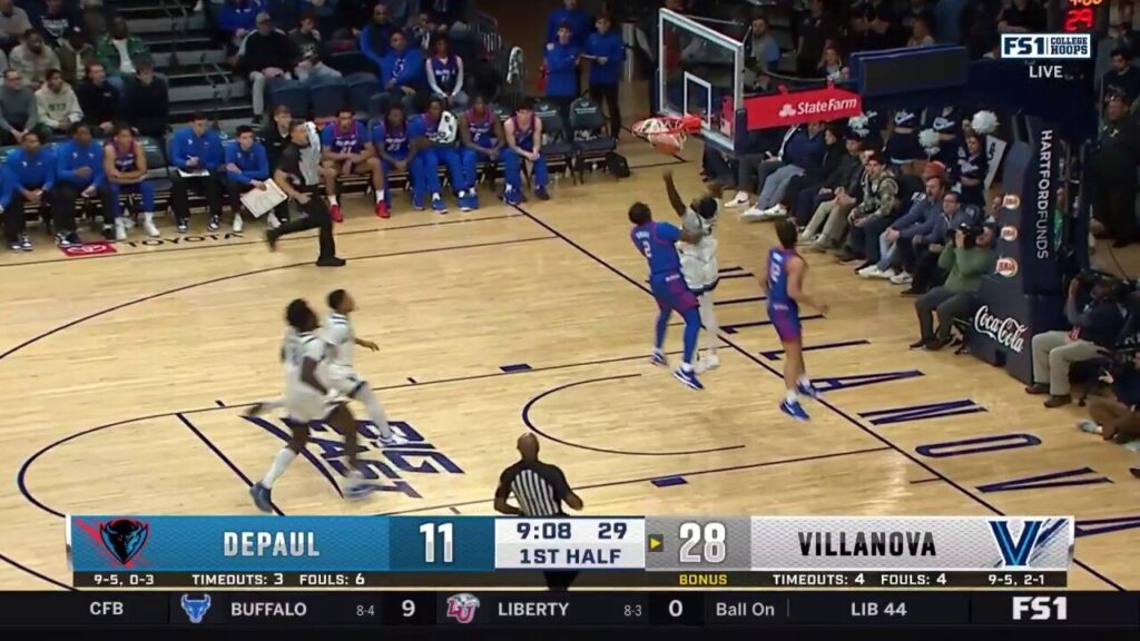 Wooga Poplar gets the steal and throws down the jam in transition, extending Villanova's lead over DePaul