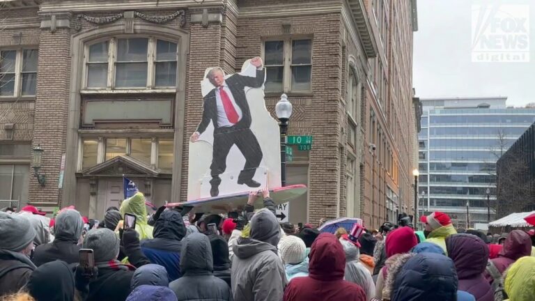 Trump cut-out crowdsurfs above rally supporters