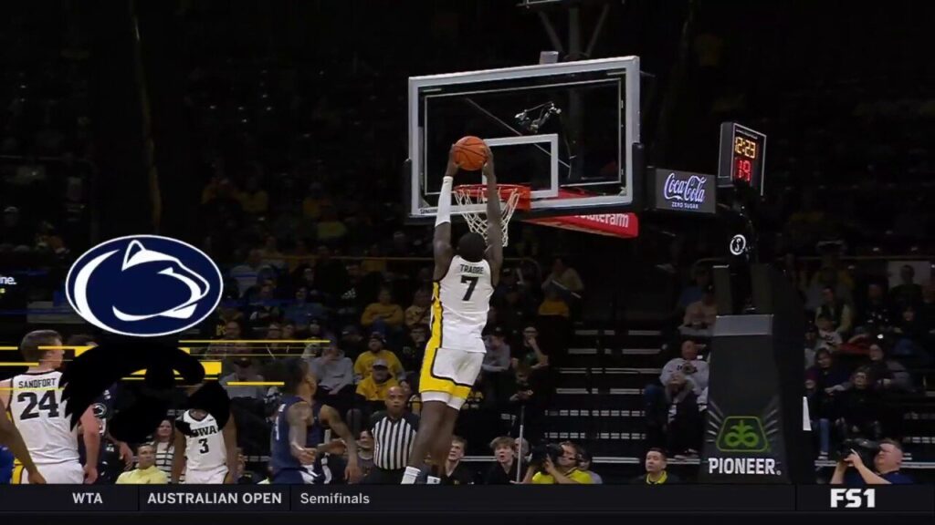 Seydou Traore throws down an alley-oop off an inbound pass to extend Iowas lead over Penn State