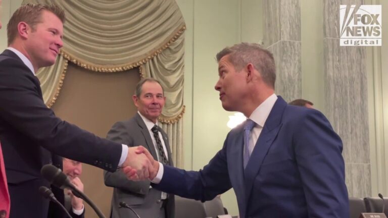 Sean Duffy shakes hands with Senators before his confirmation hearing