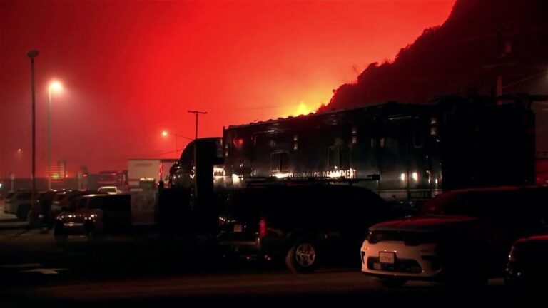 Wildfire rages in Los Angeles amid strong winds