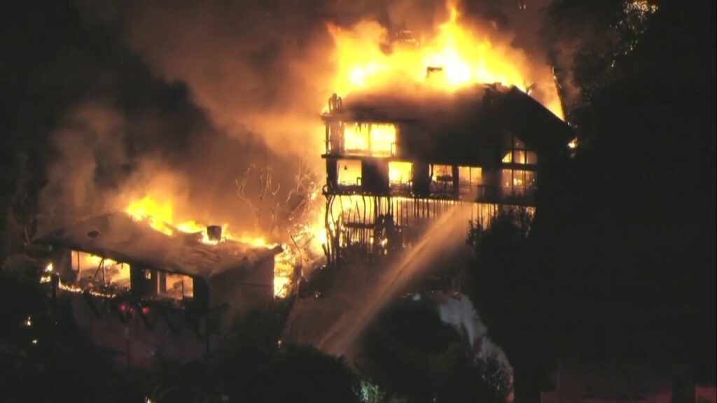 Studio City residence engulfed in flames as wildfires rage across Los Angeles