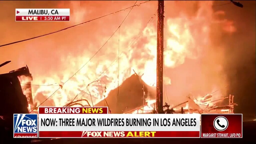 LA fire official says high winds hindering firefighting efforts from air