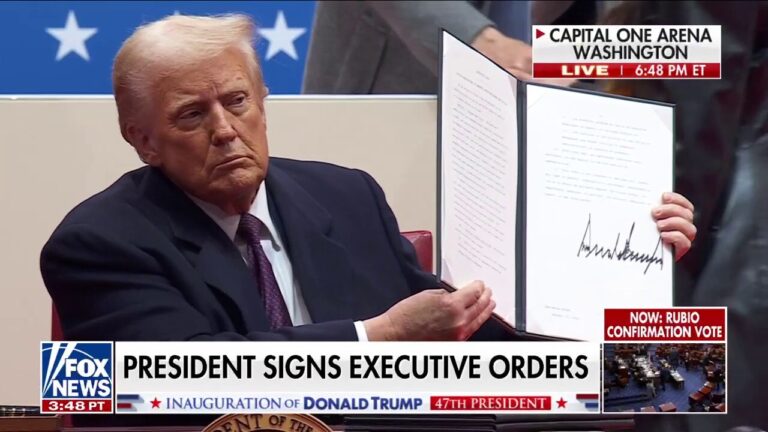 President Trump signs executive orders before supporters