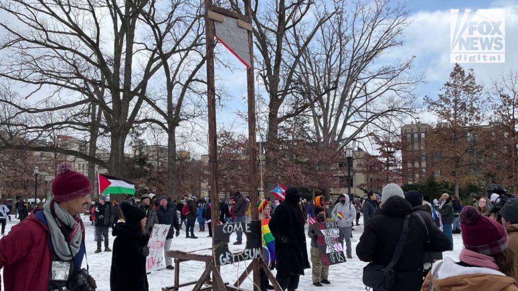 Hundreds of anti-Trump protesters rally and march near inauguration site