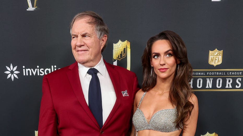 Bill Belichick's girlfriend wears one of his Super Bowl rings at NFL Honors after he fills up his own hand