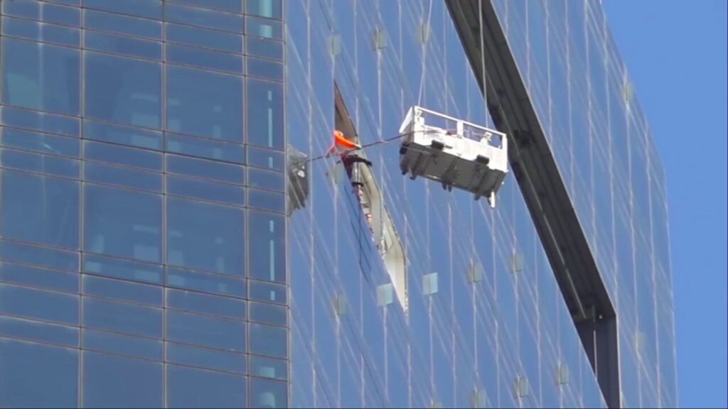 Window washers at a New York City skyscraper go for a wild ride