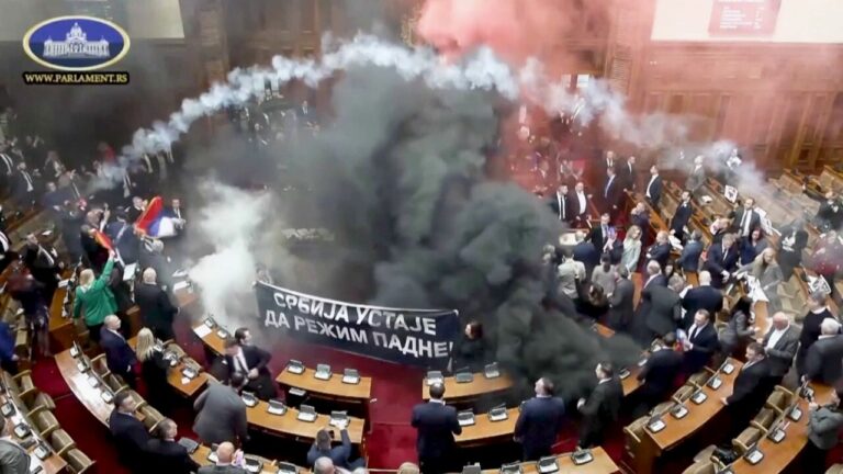 Serbian lawmakers throw smoke grenades, tear gas in parliament