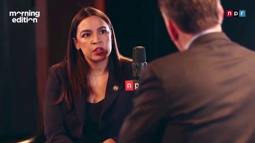 AOC asks host to clarify when he refers to the migrant crisis as a 'problem' for Democrats