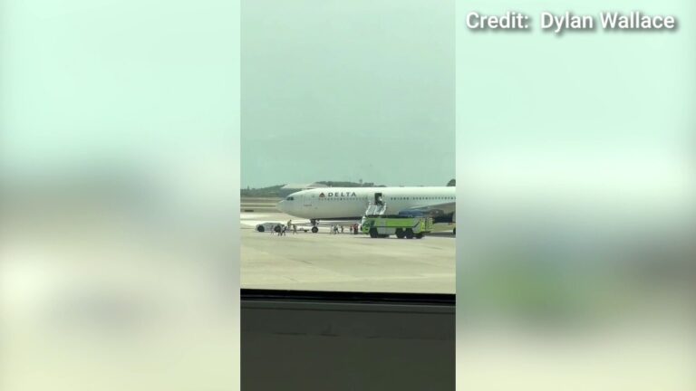 Delta flight evacuated before takeoff after flames shoot out engine