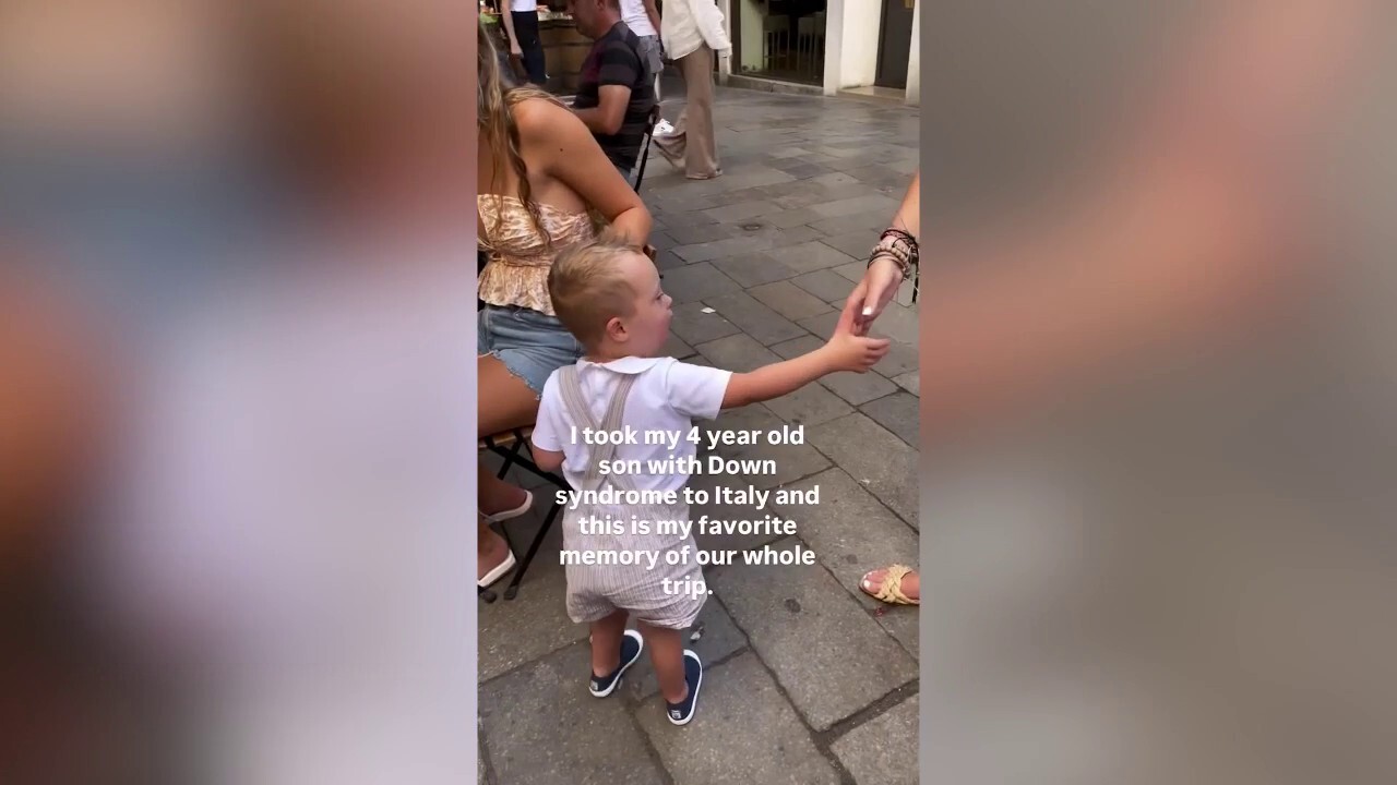 Boy sweetly pretends to serve coffee to his older sisters