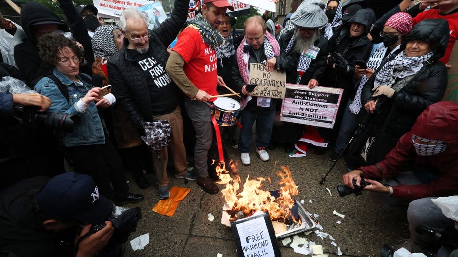 Anti-Israel protesters torch diplomas outside Columbia University on graduation day