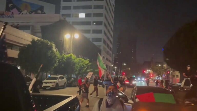 Protestors block traffic and wave Mexican flags at anti-ICE protests in Los Angeles