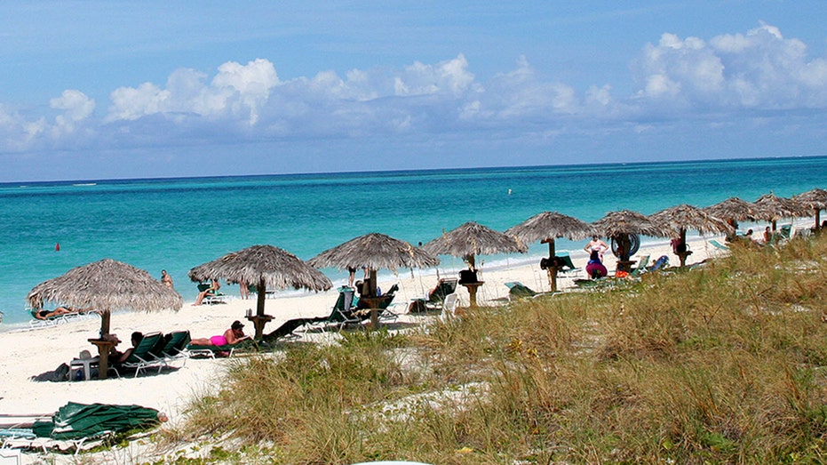 Mystery deepens as body discovered during search for missing American in island paradise