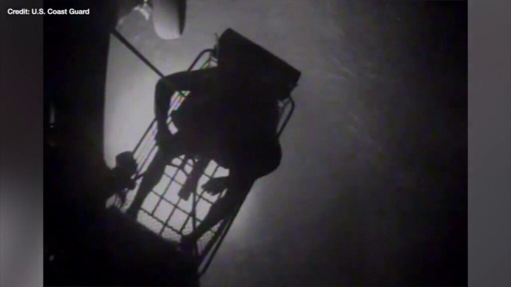 Dramatic footage shows the US Coast Guard rescuing a family of three off the coast of the Bahamas