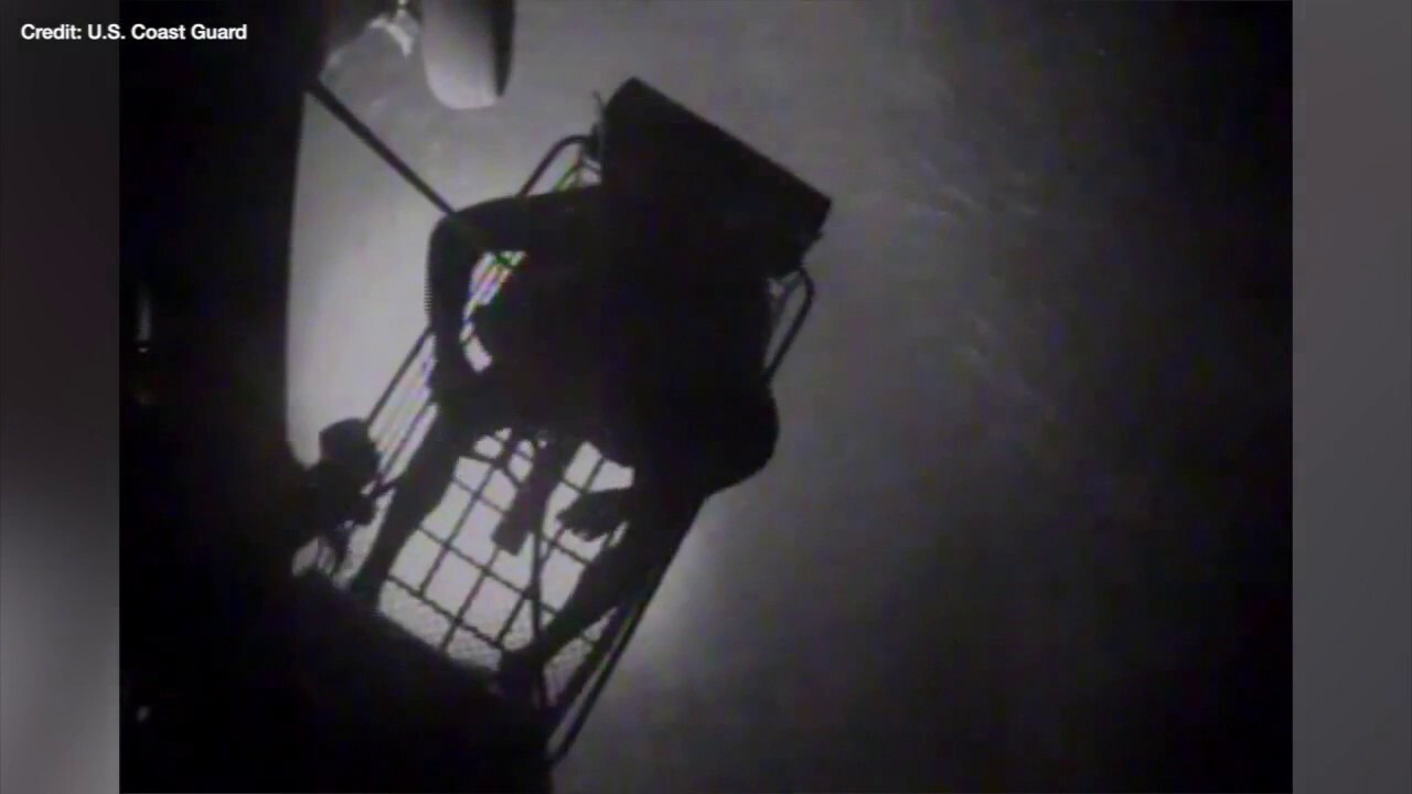 Dramatic footage shows the US Coast Guard rescuing a family of three off the coast of the Bahamas