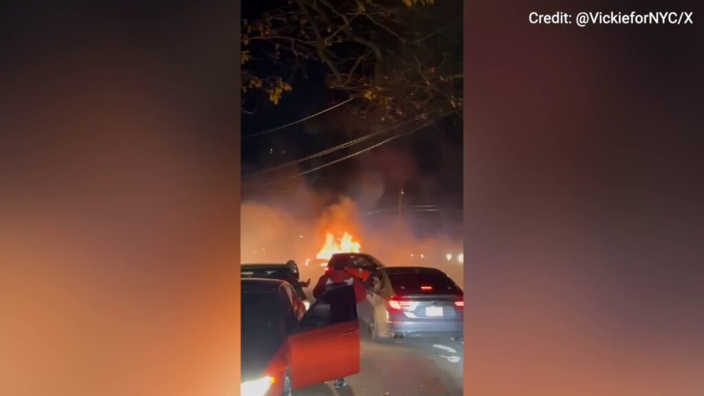 Wild footage shows a car set ablaze during a neighborhood street takeover in New York City