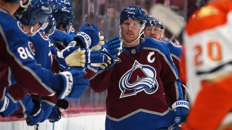 NHL fan chugs beer after catching errant puck in wild hockey moment