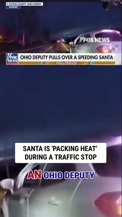 Santa is 'PACKING HEAT' during a traffic stop
