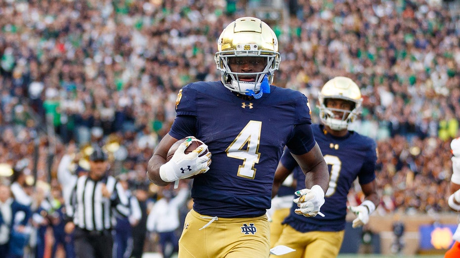 Notre Dame star 'already over' playoff snub, defends bowl opt-out as he hopes for Heisman Trophy win