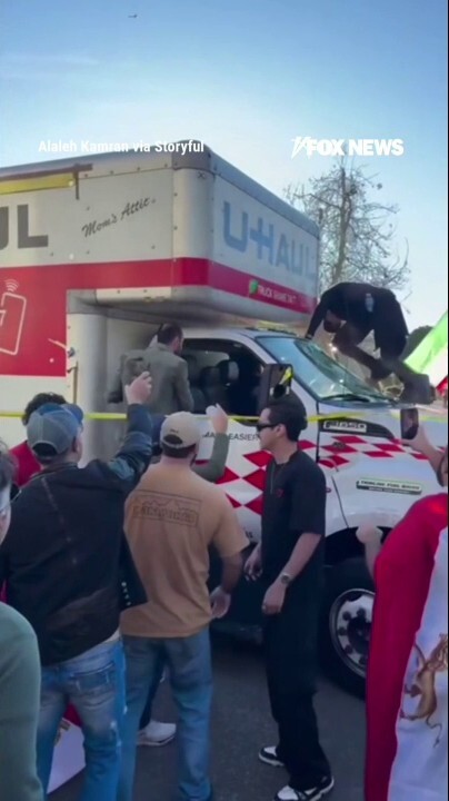 Demonstrators SWARM U-Haul after it drove through Iran protest