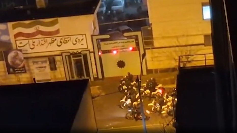 Armed Iranian protesters battle police in Tehran streets as Trump warns of forceful US response