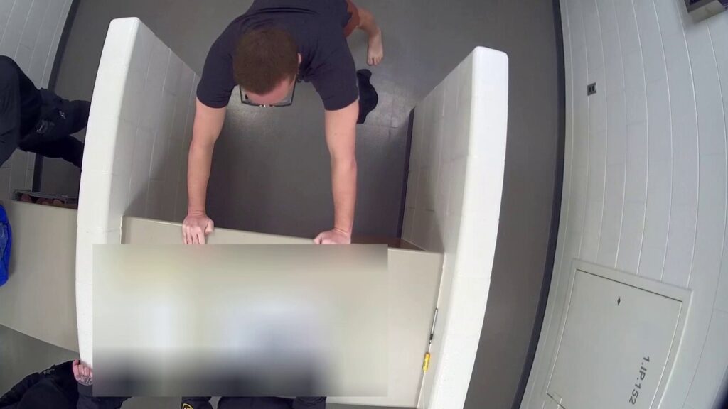 WATCH: Video shows accused killer of ex-wife and dentist husband calmly booked into jail