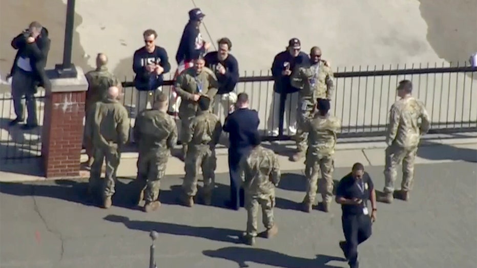 US men's hockey stars share gold medal moment with military members before White House visit