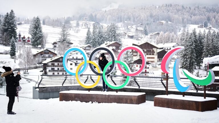 From the Olympic Village to Little League fields, sports still hold America together