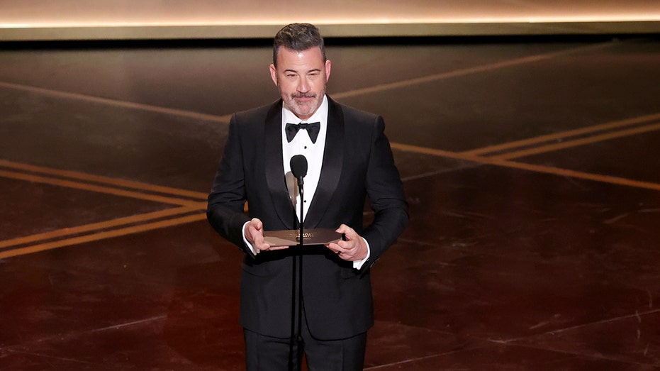 Late-night host Jimmy Kimmel shows up to 'No Kings' protest with kids, holds 'Enough Already' sign