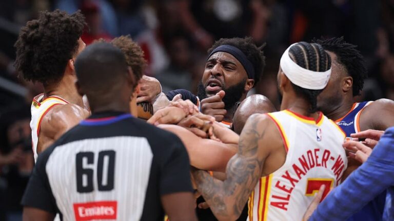 Two players ejected after scrum amid Knicks' 50-point lead against Hawks sends referee crashing to the court